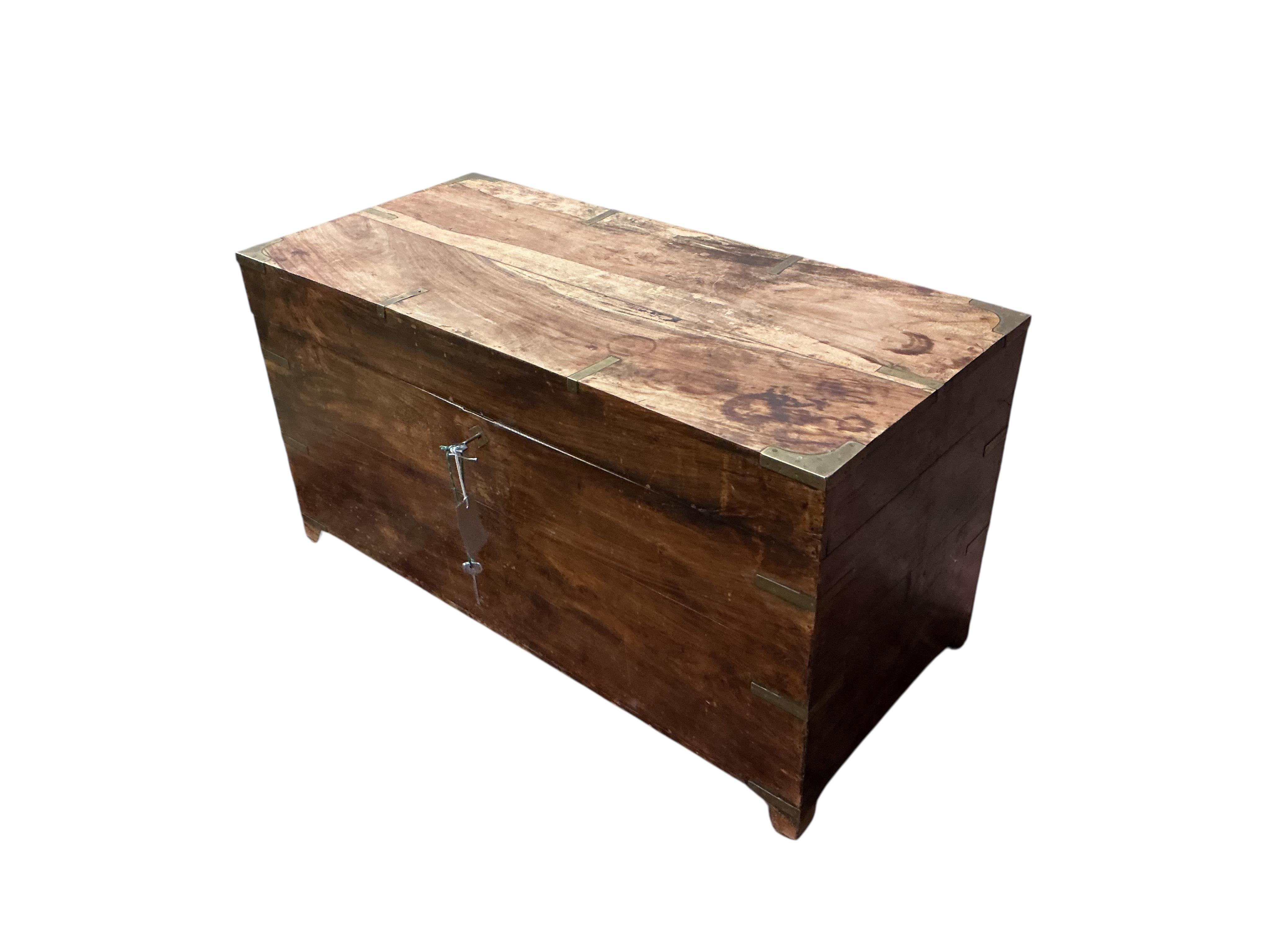 A late 19th century Anglo Indian brass bound hardwood trunk, width 86cm, depth 40cm, height 46cm